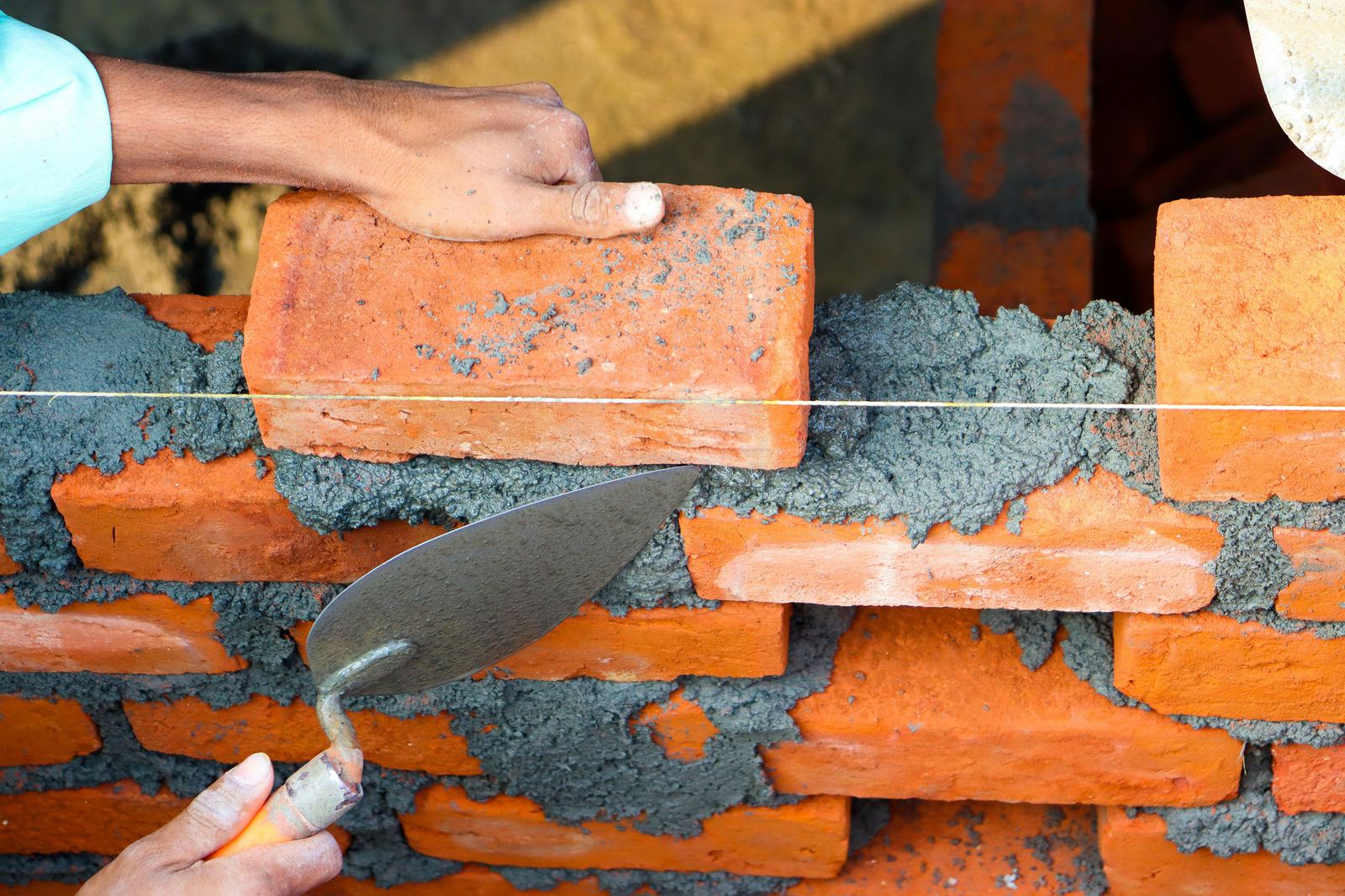 Bricklayers at work on construction site