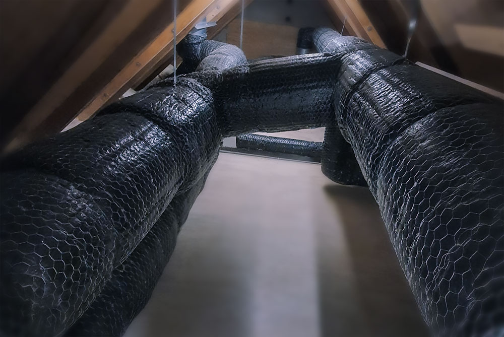 Wire mat fire insulation on ventilation ductwork